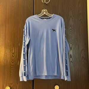 Pink long sleeeved blue top with black dog on the front and back. Size Medium